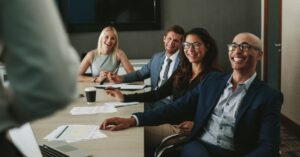 a group of Entrepreneurial gathered in a conference room for a meeting.