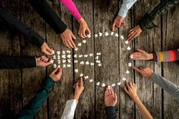 Teamwork symbolizing empathy, authenticity, and innovation.