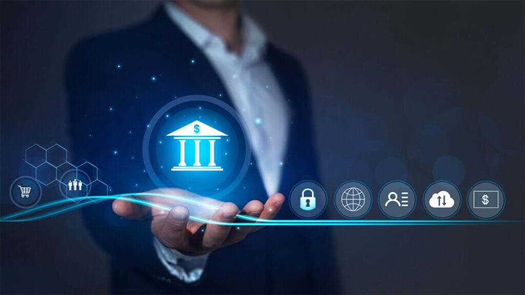 A professional in a suit is depicted holding out their hand, interacting with a futuristic interface. The central focus is a glowing blue icon of a bank building with a dollar sign on top, symbolizing financial services or banking technology. Surrounding this main icon are several smaller icons arranged along a horizontal line, each representing different aspects of digital banking and finance