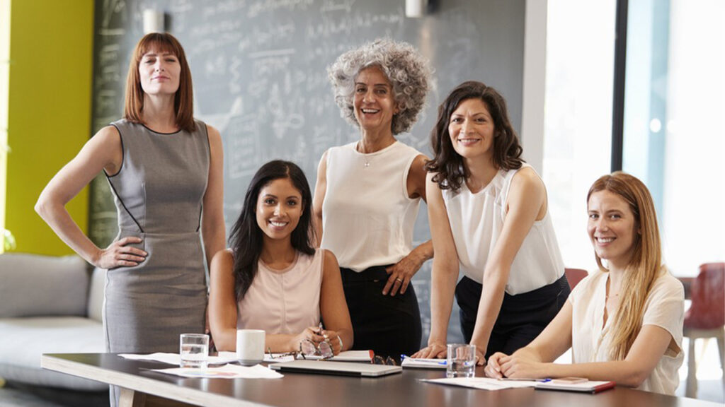 Group of confident women in a modern office setting, showcasing the benefits of Advanced NLP Techniques.
