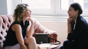 Business Coaching for Women Entrepreneurs in Toronto with female coach and client in modern office.